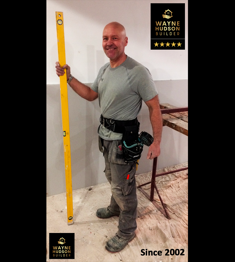 Wayne Hudson handyman Yorkshire standing with spirit level & logos